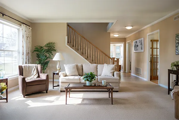 A clean, organized, sunlit senior living room