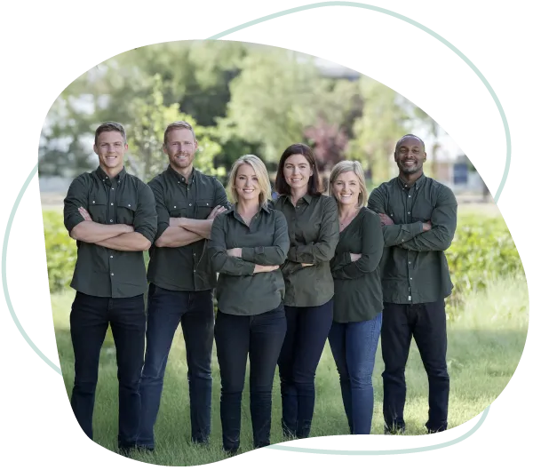 The Goldy team of Enrichment Specialists in branded polos, standing together outdoors